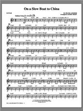 Cover icon of On a Slow Boat to China (complete set of parts) sheet music for orchestra/band by Kirby Shaw, intermediate skill level
