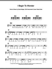 Cover icon of I Begin To Wonder sheet music for piano solo (chords, lyrics, melody) by Dannii Minogue, Dacia Bridges, Jean Claude Ades and Olaf Kramolowski, intermediate piano (chords, lyrics, melody)